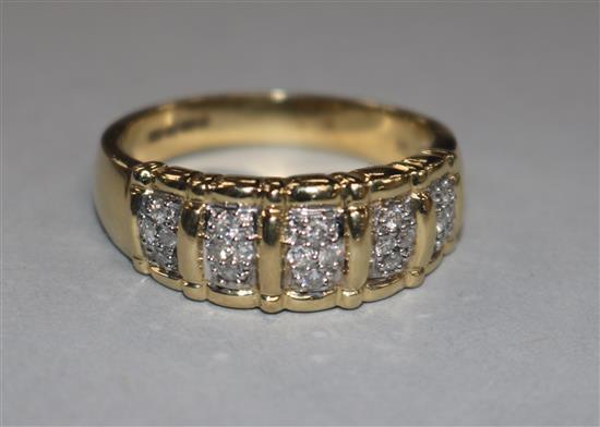 A 14ct gold and diamond gentlemans ring, with five panels of four small diamonds in claw settings